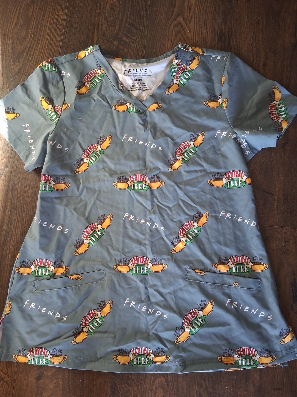 Friends Central Park Print Nursing Scrub Top - Gray Pockets.